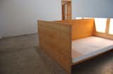 Judd designed this piece, which is a bed separated into two sleeping areas by a central plane of wood, for his two young children. It's reminiscent of the two-sided bed Frank Lloyd Wright used to nap in at Taliesin West—one side for lounging, and one side for actual sleeping.
