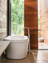 In the master bath, a Dornbracht tub filler is paired with a tub by Philippe Starck for Duravit.