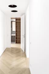 Oak flooring, laid in a herringbone pattern, is installed throughout.