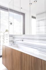 The vanity, installed an EB sink from Alape, is also custom. PSLAB is responsible for the apartment's lighting concept.&nbsp;