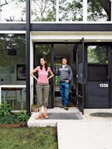 Doors, Exterior, Metal, and Swing Door Type In 2006, Alexandra and Barlow moved to Detroit from Brooklyn. The couple was heartbroken after losing a bid on a pristine townhouse, but they consoled themselves with a thoughtful renovation. Alexandra worked with contractor Joe "Schmoe" Proper from Lafayette Park Renovation to restore and update the home.  Photos from What Lies Within America’s First Urban-Renewal Project