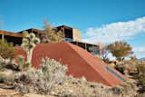 Las Vegas desert modern prefab house exterior with desert plant landscape and rust colored accents
