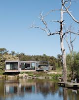 Perched above a lake on Australia’s verdant Mornington Peninsula, James and Imogen Tutton’s teak-clad house was designed by Karen Alcock of Melbourne-based MA Architects. &nbsp;