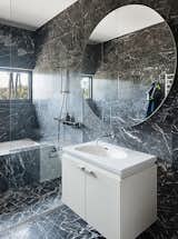 &nbsp;The marble continues in a bathroom, which has a Palomba sink from Laufen. &nbsp;