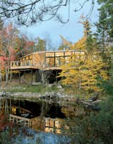 Retirees Dr. Mary Ellen Kennedy and Robert Dault tasked architect Charlie Lazor with bringing a prefabricated 2,100-square-foot home to their lakeside property, located in one of rural Ontario’s unorganized territories.  Photo 2 of 4 in This Isolated Prefab Is One with the Wild