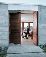 Doors, Exterior, Swing Door Type, and Wood The wide front door opens onto a wide central living space where the entire family—and a regular cast of visitors—spends much of their time.  Photo 3 of 18 in A Sonoma Prefab That Celebrates a Family’s Passion for Cooking