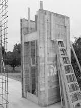 The Andersons designed a system of four-by-four-foot concrete modules, created from a reusable formwork of 2-by-12-foot boards that could be easily moved around the site. By using the units repeatedly, the architects saved on cost and materials as well as scaling the work to be manageable with one concrete truck and a two-person crew. The resulting facades are textured from the rough wooden planks.
