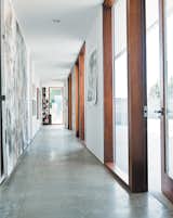 The long hallway leading to the bedrooms gets spectacular afternoon sun, lighting up the family’s many works of art.  Photo 10 of 18 in A Sonoma Prefab That Celebrates a Family’s Passion for Cooking