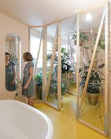 Making use of the benefits of moisture for plants, this small greenhouse has been created between a humid bathroom and a small private shower area of an apartment.&nbsp;