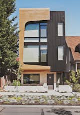 Architects Tiffany Bowie and Joe Malboeuf’s Capitol Hill, Seattle, infill project was completed for $189 per square foot. Its street-facing facade is clad in prefinished siding from Taylor Metals, and cedar shaped and cut with CNC technology. The couple was inspired by the porthole windows of the Maritime Hotel in New York City, one of their favorite buildings.  Photo 2 of 12 in Three Families Comfortably Fit in One Slim Lot