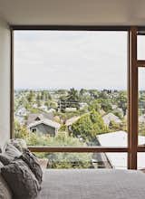 The third-floor master bedroom boasts sweeping views of Seattle.  Photo 6 of 11 in 18th Ave City Homes by Joe Malboeuf from Three Families Comfortably Fit in One Slim Lot