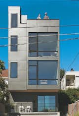 Prefinished cement fiberboard panels cover the rear facade.