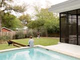 Baldridge wanted the porch to feel like another room. “When you try to make screened porches look like they’re outside, [I think] they look terrible, so we chose to make it actually be a part of the house,” he says.