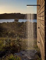 Just like the interior, the outdoor shower is an exercise in reduction and contrast: It’s merely a boulder placed under a showerhead on the side of the building. “If you really strain your eyes, you can see perhaps one other house,” Cheshire says of the vista.