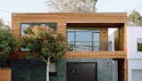 Exterior, House Building Type, Wood Siding Material, Brick Siding Material, and Flat RoofLine  Photo 13 of 23 in Modern Homes by Charles Glenn from A Meticulous Renovation Turns a Run-Down House Into a Storage-Smart Gem