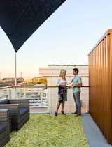 The cable railing around the perimeter of the deck is capped with a banister made of reclaimed river cypress.