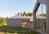 The home comprises three structures: a main house, a garage, and a studio for resident Elina Försti, an artist. Local spruce cladding, metal standing-seam roofs, and aluminum frames mean the entire complex is recyclable. “Right now, it all looks very polished, but in the future it will develop a nice patina,” Lassila says.