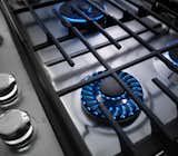 The KitchenAid cooktop features a precise Torch Burner flame that makes it easy to adjust heat levels, from a small flame for simmering to a larger flame designed to distribute heat evenly. The surface is also coated in a finish that makes it a quick clean.