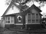 With a fresh coat of black Dulux paint on the trim, the front facade retains its original early-20th-century appeal.  Photo 7 of 12 in An Unassuming Edwardian Saves the Best for Out Back