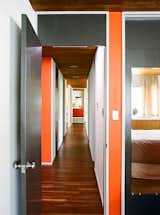 Hallway and Medium Hardwood Floor Cashmere flat paint by Sherwin-Williams was custom matched to the original chips provided by Breuer’s firm—dark gray for the wood doors and MB Red for accents.  Photo 4 of 15 in Kansas City Royal
