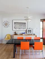 Architect Chris Fein’s family home in Kansas is a showcase for modern design pieces, including a Le Corbusier LC6 dining table, chairs by Maarten Van Severen for Vitra, and a Louis Poulsen pendant. The sideboard is a Florence Knoll design from 1952, about the time the house was built.