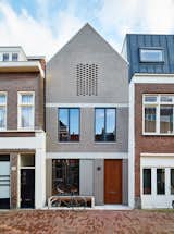 By setting an Amsterdam house a few feet back from the street, 31/44 Architects ensured the city’s planning department that the new construction would not block light to the surrounding structures. The gray brick facade references the building material of choice in the formerly industrial neighborhood, which has seen a residential resurgence.