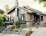 The 1912 Craftsman bungalow appears unchanged from the street, part of Cheng and Snyder’s strategy to maintain the neighborhood’s existing architectural character and appease local preservationists. A dark-gray finish from Glidden custom matches the home’s original color and contrasts with the bright interiors.