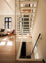 “From the day we got our house, I knew exactly how I wanted it done,” says Mia Dalgas, who led the renovation of her family’s 1880s home in Copenhagen’s Potato Rows district. One of the biggest transformations was the addition of a glass-enclosed lacquered wood staircase.