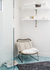 Dandelion cement tiles from Marrakech Design adorn the master bathroom. The chair is from Lawson Fenning.