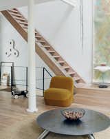 Venlet’s prototype of the armless Emperor’s Hat Chair sits near his Cuppa coffee table, made of Cor-Ten and stainless steel.  Photo 4 of 11 in Futuristic Forms Meet Historical Details in Designer Danny Venlet's Brussels Home