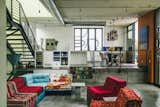 &nbsp;Inside, a colorful sectional softens the industrial vibe.
