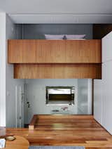 The unusual layout of René Roupinian’s Upper West Side home is what initially attracted her to the space, but the three-level plan proved difficult to organize. In his first solo project as STADT Architecture, Christopher Kitterman used a palette of walnut and white to unify the apartment, which he filled with space-saving solutions. Near the entrance, a Goliath table from Resource Furniture can expand to seat up to 10.