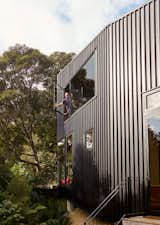 Milton cracks open a window oriented to balance solar gain with a cooling stack effect.  Photo 9 of 13 in A Tiny Footprint Isn’t So Bad When You Live in a Tower