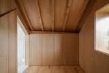 The majority of storage units are concealed by single materials. The closet on the top floor is covered in wood.&nbsp;