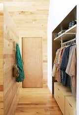 Storage Room and Closet Storage Type IKEA’s Stolmen system holds the couple’s clothes in the master bedroom. Solid core maple doors from Lowe’s match the structure’s interiors, which are lined in wood largely sourced from Union Church Millworks.  Photo 7 of 8 in Happy Trails