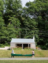 Exterior, House Building Type, Metal Roof Material, Wood Siding Material, and Gable RoofLine Architects Gerard Damiani and Debbie Battistone turned a budget buy into a condensed cabin getaway.  Photo 1 of 65 in Cabin by Casey Tiedman from Cottage Industrious