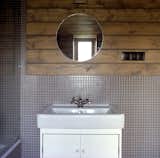 By the entrance to the master suite, a mirror sits on a table of Ovchinnikov’s design.  Photo 7 of 8 in Seeing Double