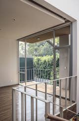 A reveal in the studio ceiling provides a track for curtains—and highlights an architectural detail. “I like to show the difference between the interior ceiling and the structural roof,” Paul explains.  Photo 10 of 12 in Retired Couple Build Modern in Mexico City