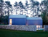 The stone treatment works as a connecting factor throughout the property and preserves a building practice that was common at the time. 