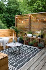 Modern and minimal doesn't mean unlivable, rugs make outdoor spaces inviting.  Photo 1 of 10 in 10 Ways to Use Rugs in Your Outdoor Space This Spring