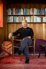 Charles de Lisle is shown here sitting in his Marin, California home. As a designer of furniture, lighting and objects, he mixes unexpected materials and mediums to create useful objects that are full of texture and character.