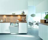 This white Miele model is designed to blend seamlessly into white kitchen cabinetry. The brand’s patented Knock2Open technology does away with handles, allowing for a completely flush façade that users tap twice to gain access. It comes equipped with an adjustable cutlery tray and interior LED lights, and it automatically recognizes how full the load is and adjusts energy and water use accordingly. It is also one of the quietest dishwashers available at 38 decibels.  Photo 3 of 6 in 5 Modern Dishwashers