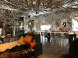 After seeing a mylar installation by a friend of theirs, they decided to drape their dining room with the bold material.