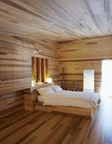 Bedroom, Light Hardwood Floor, and Bed The custom bed features under-mattress drawers.  Photo 9 of 12 in Sliding House by Dwell from Lights Will Guide You Home