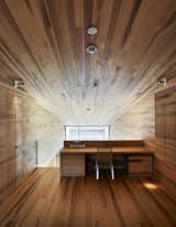 The bold, streaky patterning of the grain of the walls, ceiling, floor, and desk all point to poplar.