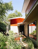 Outdoor, Vegetables, and Gardens In a historic section of Raleigh, North Carolina, a modern home designed by Louis Cherry became the subject of a lengthy court battle. The house is clad in local cypress and HardiePanel siding in Stormy Monday by Benjamin Moore.  Photo 7 of 11 in Garden by Kevin Lawrence from Shelter From the Storm