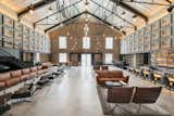Designed by Asylum and Zarch Collaborative, the converted warehouse boasts a lobby with vaulted ceilings that puts a spotlight on the original pulley systems that were commonly found in godowns.