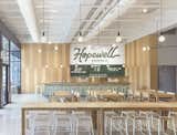 In the American midwest, Hopewell Brewing Co. manages to channel multiple styles at once. The signage has an almost 1950s nostalgia about it, while the light fixtures are utterly modern and minimalistic.