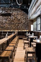 A rustic setting indeed. Between the tree trunk cross sections and mixed wood tones throughout the space, this beer house makes you feel like you are gathering in a Bavarian forest.  Photo 10 of 10 in 10 Cozy Spaces and 15 Products to Help You Get Ready For Fall