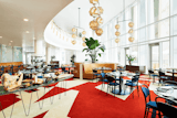 Dining Room, Pendant Lighting, Recessed Lighting, Carpet Floor, Table, and Chair The 53 rooms of The Durham Hotel – a mid-century modern boutique, hotel in the heart of downtown Durham are decked out in the bold Bauhaus colors of yellow, red and blue.  Search “������������������������������:PC53��������������� ��������� ������������������������,������������������,���������������������,���������������������” from Follow Us to 10 Midcentury Modern-Inspired Hotels Around the Globe